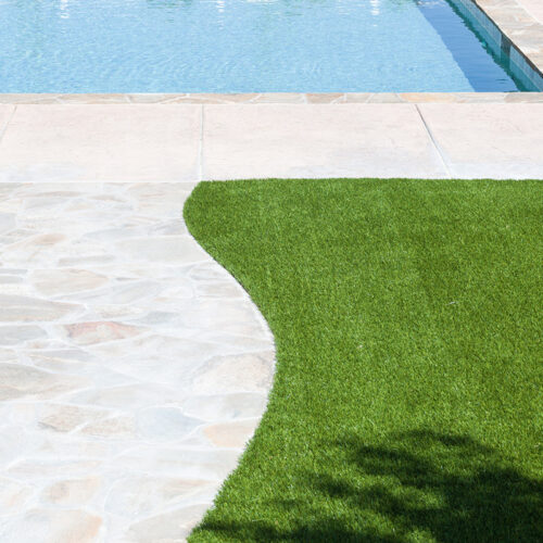 artificial turf by a pool by BrightWater Irrigation & Lighting’s turfing experts in the Orlando FL area